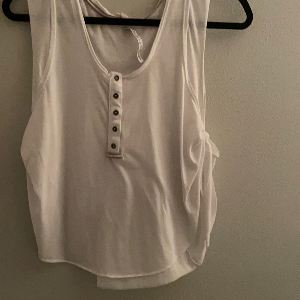 White free people tank! Super comfy and cute. Perfect for any occasion.